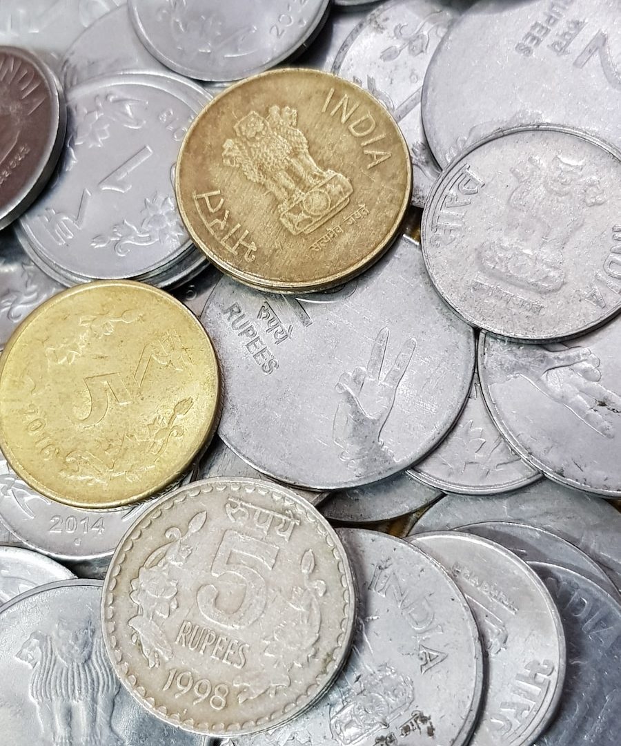 a pile of british coins sitting on top of each other