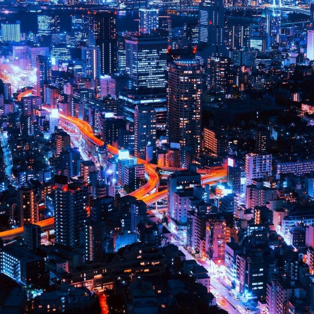 timelapse photography of vehicles and buildings